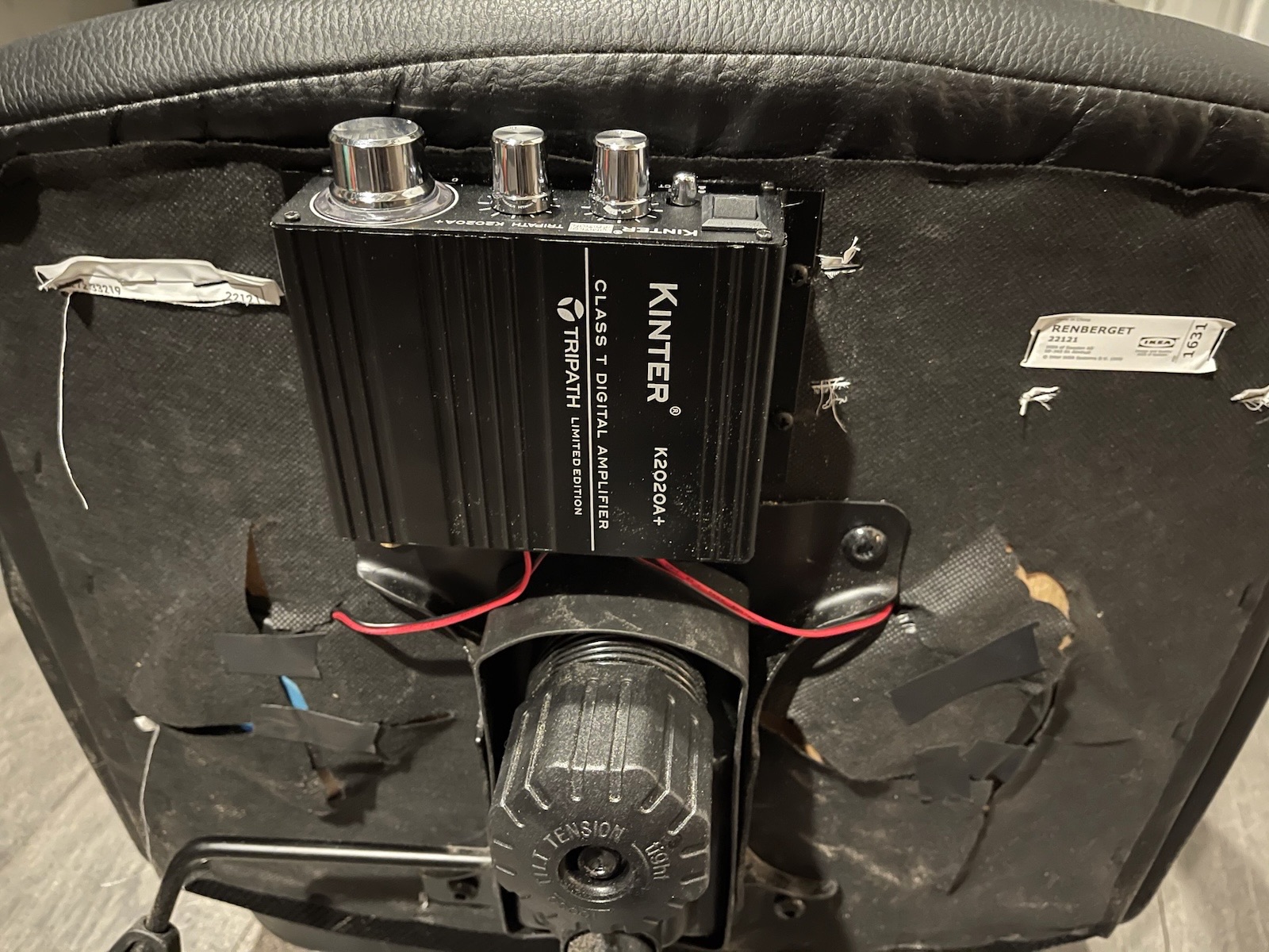 The amp mounted under the chair and wired to the transducers.